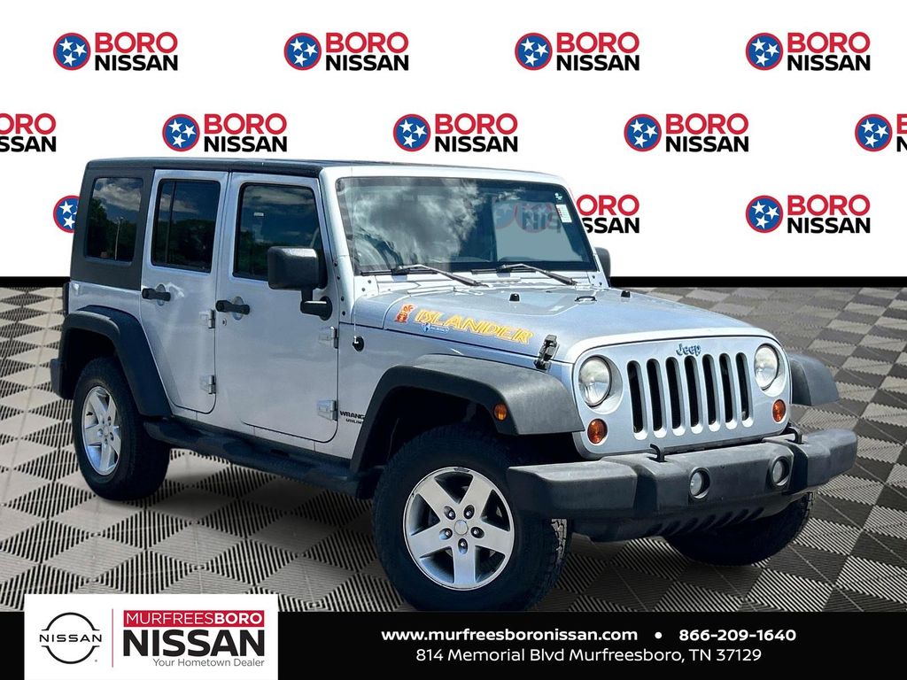 Bright Silver Metallic Clearcoat 2010 Jeep Wrangler Unlimited Sport 4WD SUV / Crossover Four-Wheel Drive 4-Speed Automatic
