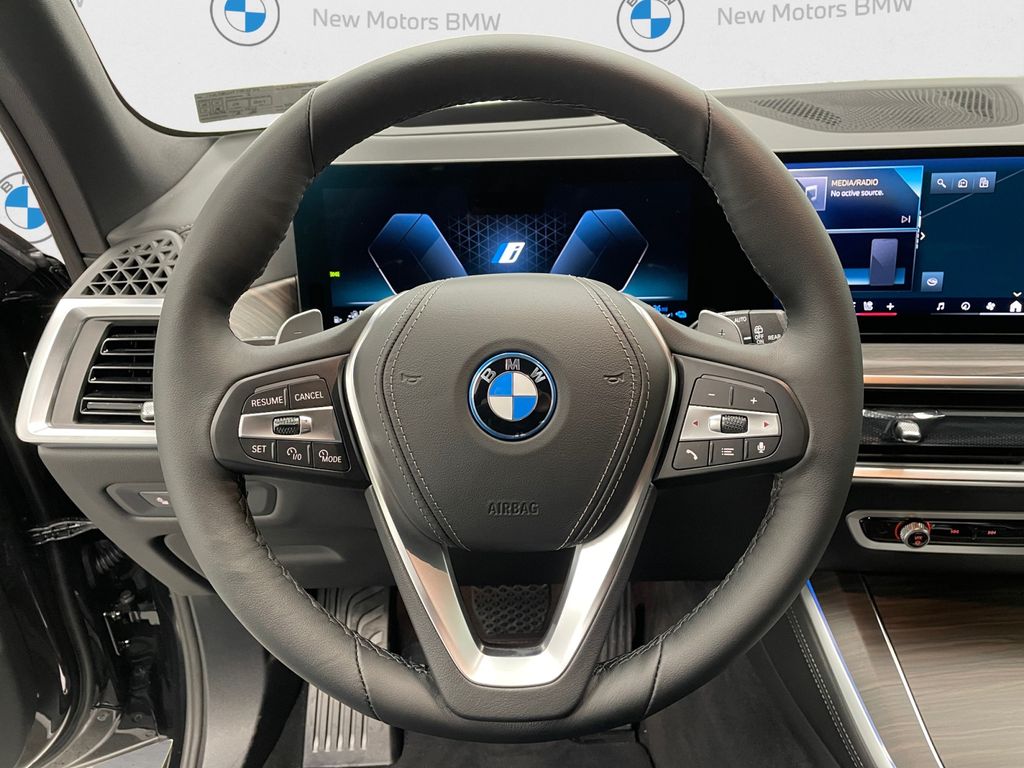 New 2026 Black Sapphire Metallic BMW xDrive50e image 9