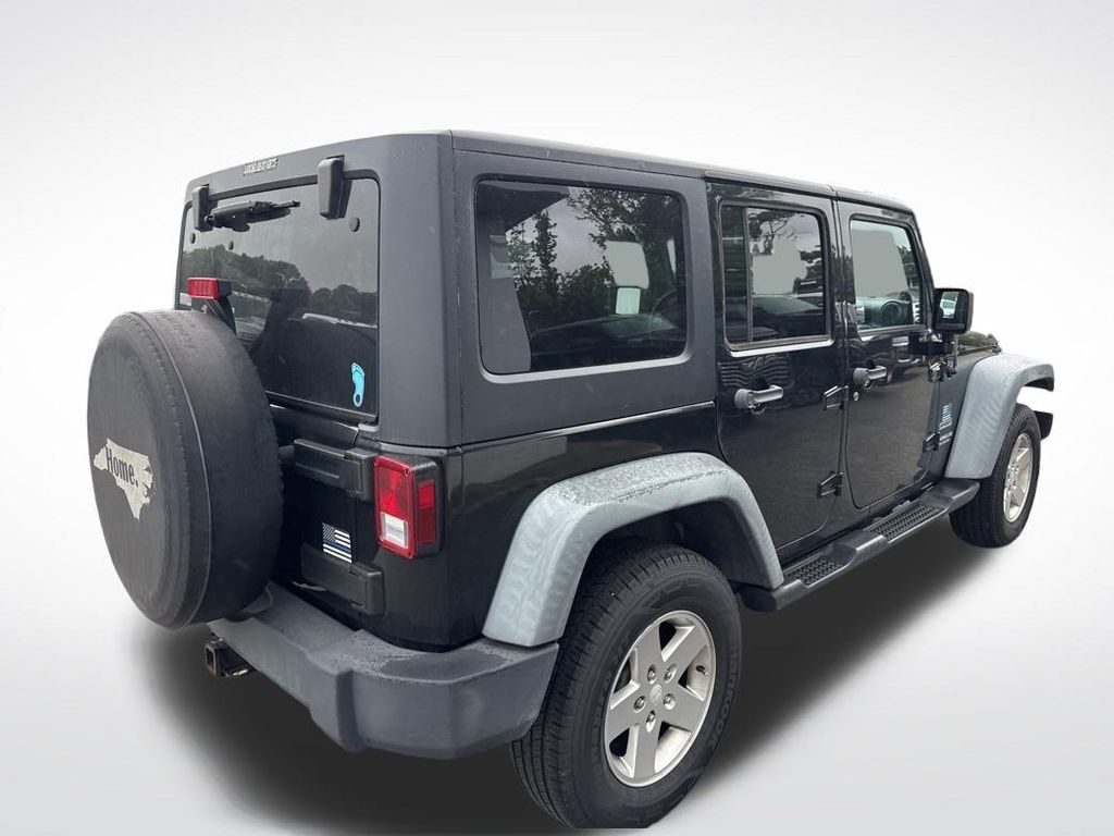 Used 2012 Black Jeep Unlimited Sport image 12