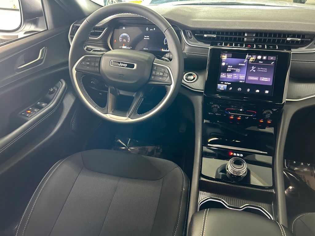 Used 2025 Bright White Clearcoat Jeep Laredo image 9