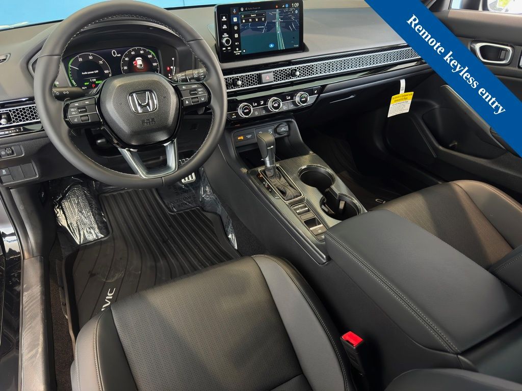 2026 Honda Civic Hybrid Sport Touring Black at Shottenkirk Kia Fort Bend