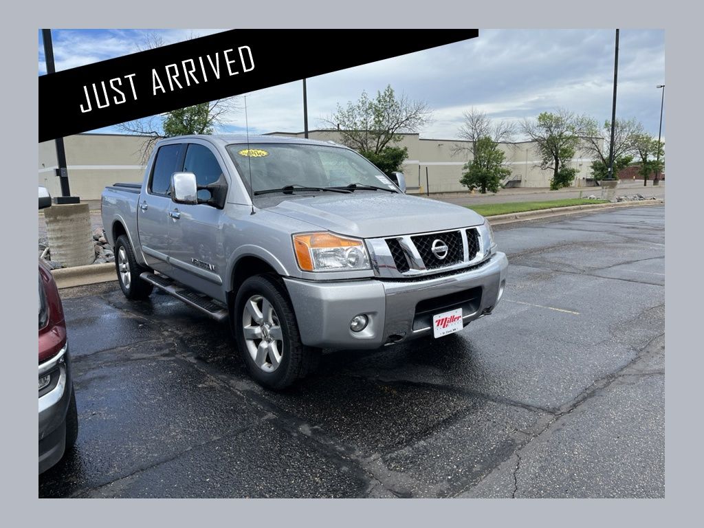 Silver Lightning Metallic 2009 Nissan Titan LE Crew Cab 4WD Pickup Truck Four-Wheel Drive 5-Speed Automatic