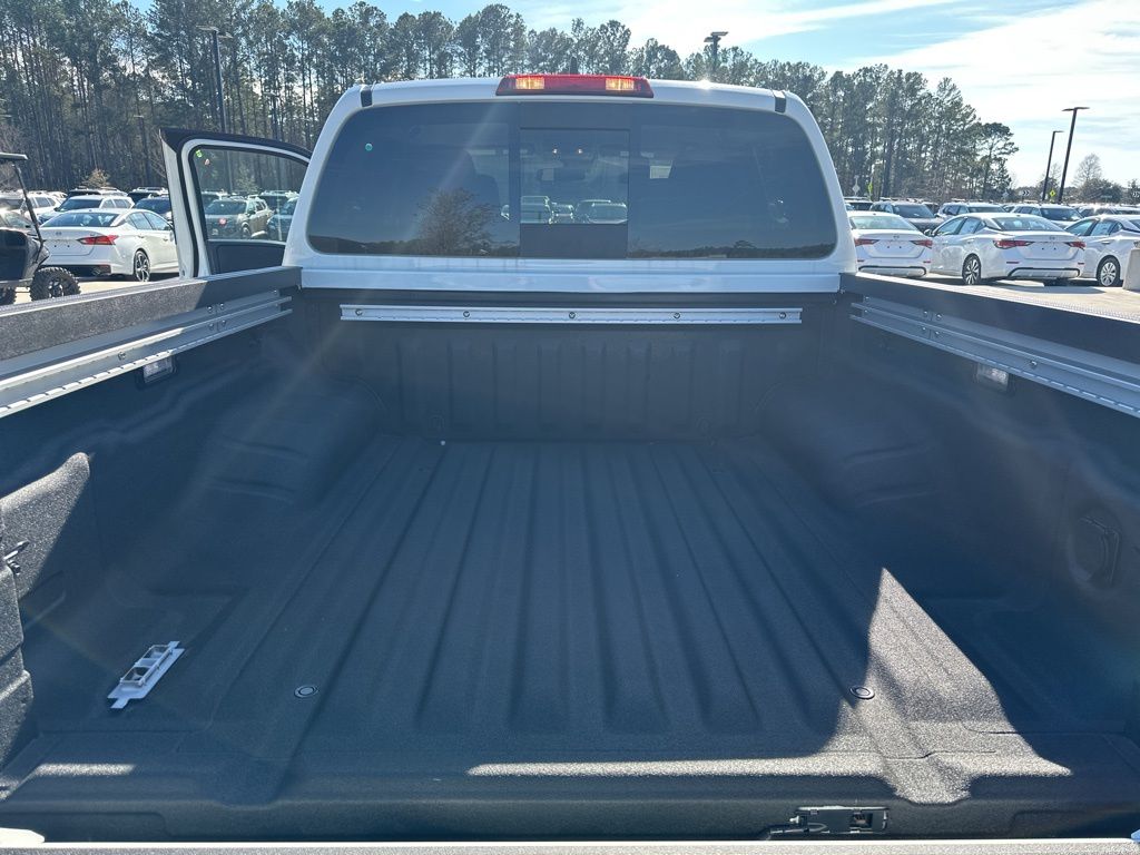 2025 Glacier White Nissan Frontier SV 4X4 Truck