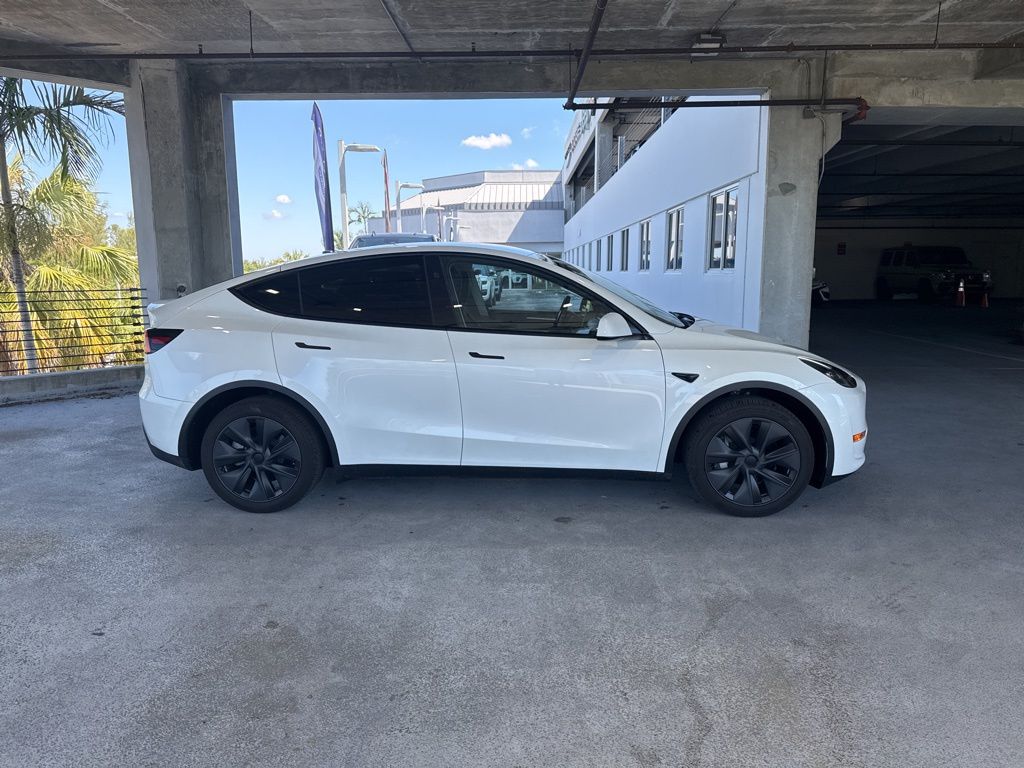 Used 2025 Tesla Model Y Long Range with VIN 7SAYGDEE6SA361053 for sale in Tamarac, FL