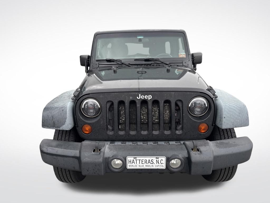 Used 2012 Black Jeep Unlimited Sport image 9