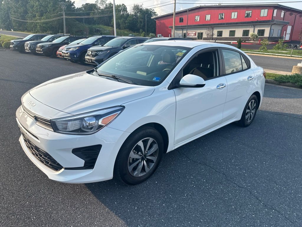 Clear White 2023 Kia Rio Sedan Front-Wheel Drive Continuously Variable Transmission