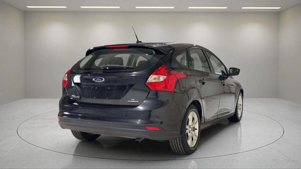 Used 2014 Tuxedo Black Metallic Ford SE image 3