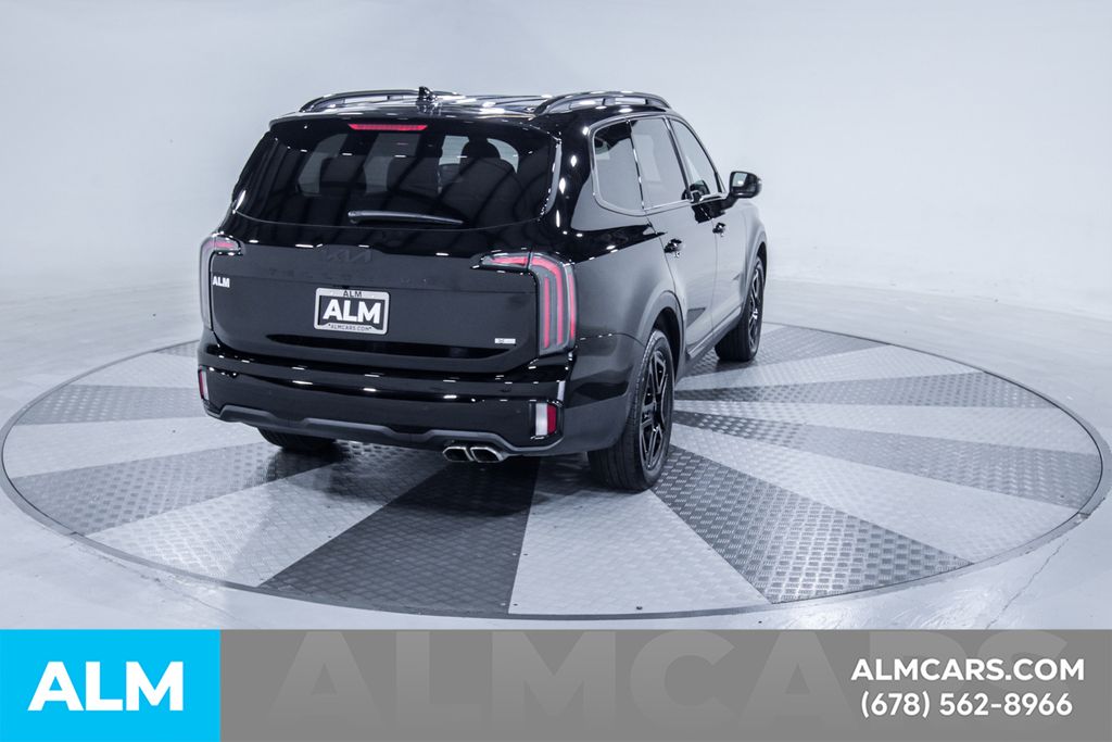 Used 2025 Black Kia EX X-Line image 9