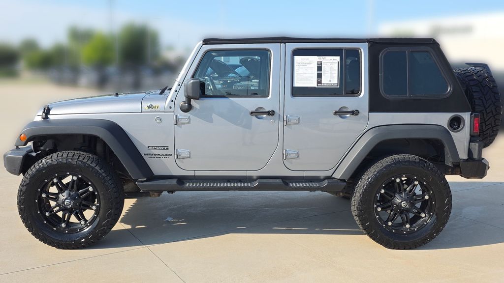 Used 2015 Jeep Wrangler Unlimited Sport with VIN 1C4BJWDG2FL506744 for sale in Kansas City
