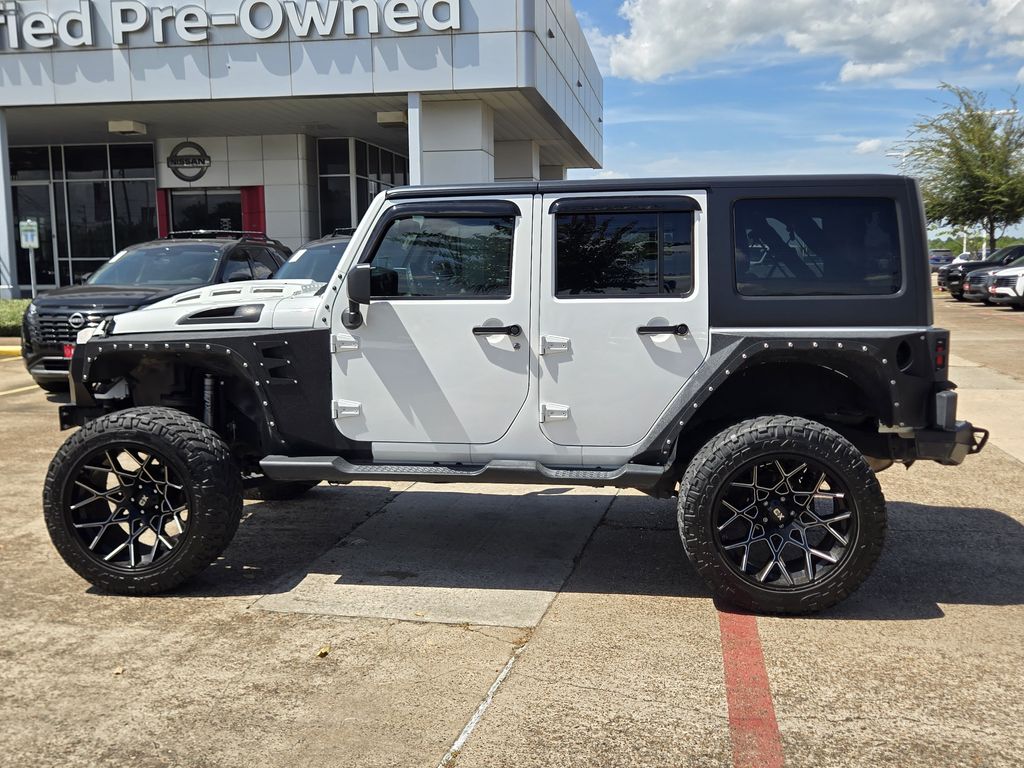 2015 Jeep Wrangler Unlimited Sahara White at DeMontrond Automotive Group