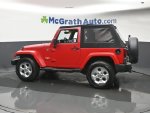 2014 Jeep Wrangler Sahara — Flame Red Clearcoat interior and detail view 20, for sale at McGrath Ford in Hiawatha, IA