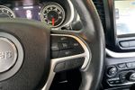 2015 Jeep Cherokee Trailhawk — Deep Cherry Red Crystal Pearlcoat interior and detail view 12, for sale at Lakeside Automotive Group in Spring Lake, MI
