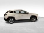 2026 Hyundai Tucson Hybrid SEL — White Pearl exterior view 3, for sale at McGrath Ford in Hiawatha, IA