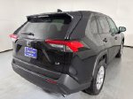 2025 Toyota RAV4 LE — Midnight Black Metallic exterior view 8, for sale at Courtesy Volvo Cars of Scottsdale in Scottsdale, AZ