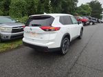 2025 Nissan Rogue SV — White Pearl exterior view 2, for sale at McGrath Ford in Hiawatha, IA