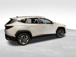 2026 Hyundai Tucson Hybrid SEL — White Pearl exterior view 5, for sale at McGrath Ford in Hiawatha, IA