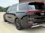 2024 Kia Carnival SX — Aurora Black exterior view 8, for sale at Velocity Auto Source in RICHMOND, KY