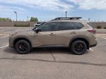 2026 Nissan Rogue Rock Creek — Baja Storm Metallic exterior view 5, for sale at Courtesy Nissan of Mesa in Mesa, AZ