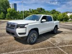 2026 Nissan Frontier SV — Glacier White exterior view 2, for sale at Downtown Nashville Nissan in Nashville, TN