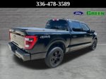 2023 Ford F-150 Lariat — Black Metallic exterior view 6, for sale at Green Ford in Greensboro, NC