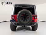 2015 Jeep Wrangler Unlimited Freedom Edition — Red exterior view 4, for sale at RDS Ineos Grenadier in Devon, PA