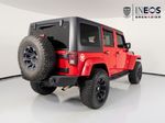 2015 Jeep Wrangler Unlimited Freedom Edition — Red exterior view 5, for sale at RDS Ineos Grenadier in Devon, PA