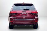 2021 Jeep Grand Cherokee Laredo X — Velvet Red Pearlcoat exterior view 6, for sale at Lakeside Automotive Group in Spring Lake, MI