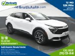2024 Kia Sportage EX — White Pearl primary exterior view, for sale at McGrath Ford in Hiawatha, IA