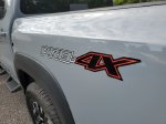 2024 Nissan Frontier PRO-4X — Boulder Gray exterior view 8, for sale at Downtown Nashville Nissan in Nashville, TN