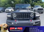 2024 Jeep Wrangler Rubicon — Black Clearcoat exterior view 4, for sale at Autostar CDJR of Hendersonville in Hendersonville, NC