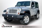 2011 Jeep Wrangler Sport — Bright Silver Metallic primary exterior view, for sale at Lakeside Automotive Group in Spring Lake, MI