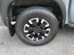 2024 Nissan Frontier PRO-4X — Boulder Gray exterior view 5, for sale at Downtown Nashville Nissan in Nashville, TN
