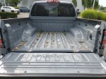 2024 Nissan Frontier PRO-4X — Boulder Gray exterior view 7, for sale at Downtown Nashville Nissan in Nashville, TN