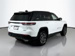 2023 Jeep Grand Cherokee Trailhawk 4xe — Bright White Clearcoat exterior view 5, for sale at Legend  Auto Sales in Puyallup, WA