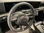 2026 Hyundai Tucson Hybrid Blue SE — Gray interior and detail view 12, for sale at McGrath Ford in Hiawatha, IA