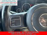 2016 Jeep Wrangler Unlimited Sport — Black Clearcoat interior and detail view 13, for sale at Shift Innovations Car Co in Puyallup, WA