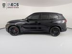 2026 BMW X5 xDrive40i — Black Sapphire Metallic exterior view 2, for sale at RDS Ineos Grenadier in Devon, PA