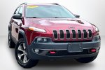 2015 Jeep Cherokee Trailhawk — Deep Cherry Red Crystal Pearlcoat exterior view 3, for sale at Lakeside Automotive Group in Spring Lake, MI