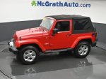 2014 Jeep Wrangler Sahara — Flame Red Clearcoat interior and detail view 19, for sale at McGrath Ford in Hiawatha, IA