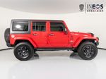 2015 Jeep Wrangler Unlimited Freedom Edition — Red exterior view 6, for sale at RDS Ineos Grenadier in Devon, PA