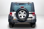 2011 Jeep Wrangler Sport — Bright Silver Metallic exterior view 6, for sale at Lakeside Automotive Group in Spring Lake, MI