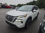 2025 Nissan Rogue SV — White Pearl exterior view 5, for sale at McGrath Ford in Hiawatha, IA
