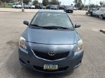 2009 Toyota Yaris Base — Pacific Blue Metallic exterior view 2, for sale at McGrath Ford in Hiawatha, IA