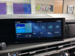2026 Hyundai Santa Fe Hybrid SEL — White interior and detail view 16, for sale at McGrath Ford in Hiawatha, IA