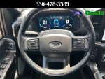 2023 Ford F-150 Lariat — Black Metallic interior and detail view 16, for sale at Green Ford in Greensboro, NC