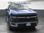 2025 Ford F-150 XLT — Blue Metallic exterior view 5, for sale at McGrath Ford in Hiawatha, IA
