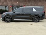 2024 Kia Carnival SX — Aurora Black exterior view 5, for sale at Velocity Auto Source in RICHMOND, KY