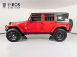 2015 Jeep Wrangler Unlimited Freedom Edition — Red exterior view 2, for sale at RDS Ineos Grenadier in Devon, PA