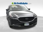 2019 Mazda CX-5 Touring — Jet Black exterior view 5, for sale at McGrath Ford in Hiawatha, IA