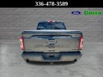 2023 Ford F-150 Lariat — Black Metallic exterior view 5, for sale at Green Ford in Greensboro, NC